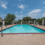 outdoor pool with chair lift at Super 8 by Wyndham Fort Worth South